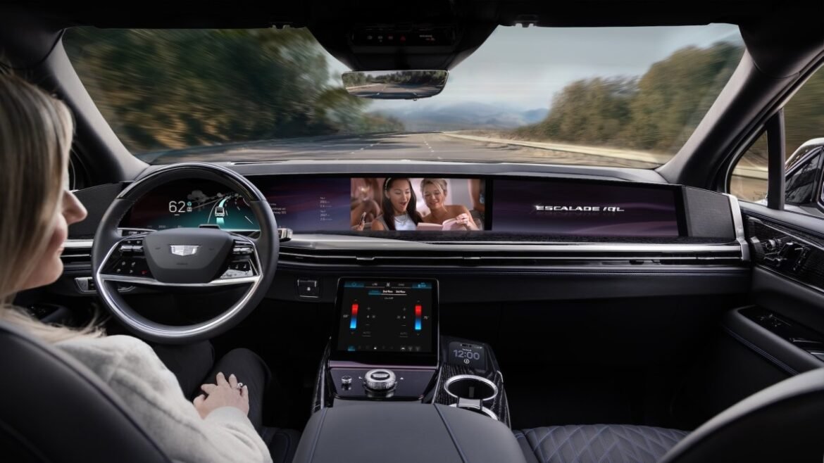 The interior of the upcoming Cadillac Escalade shows a driver watching a movie as the automated system handles the driving.