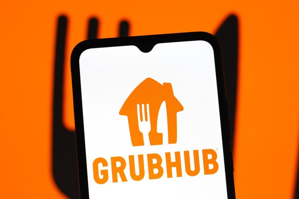 In this photo illustration, the GrubHub logo is seen displayed on a smartphone screen.