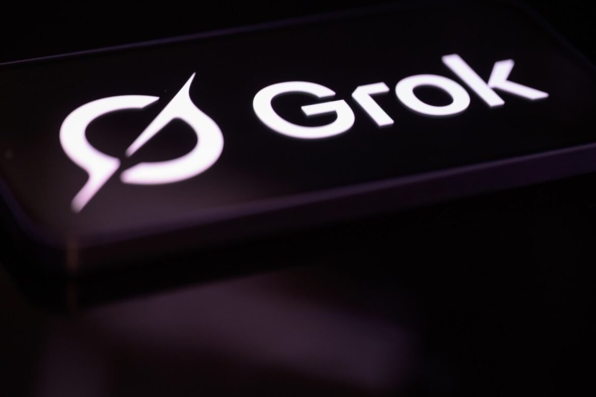 The Grok logo is displayed on a mobile phone screen